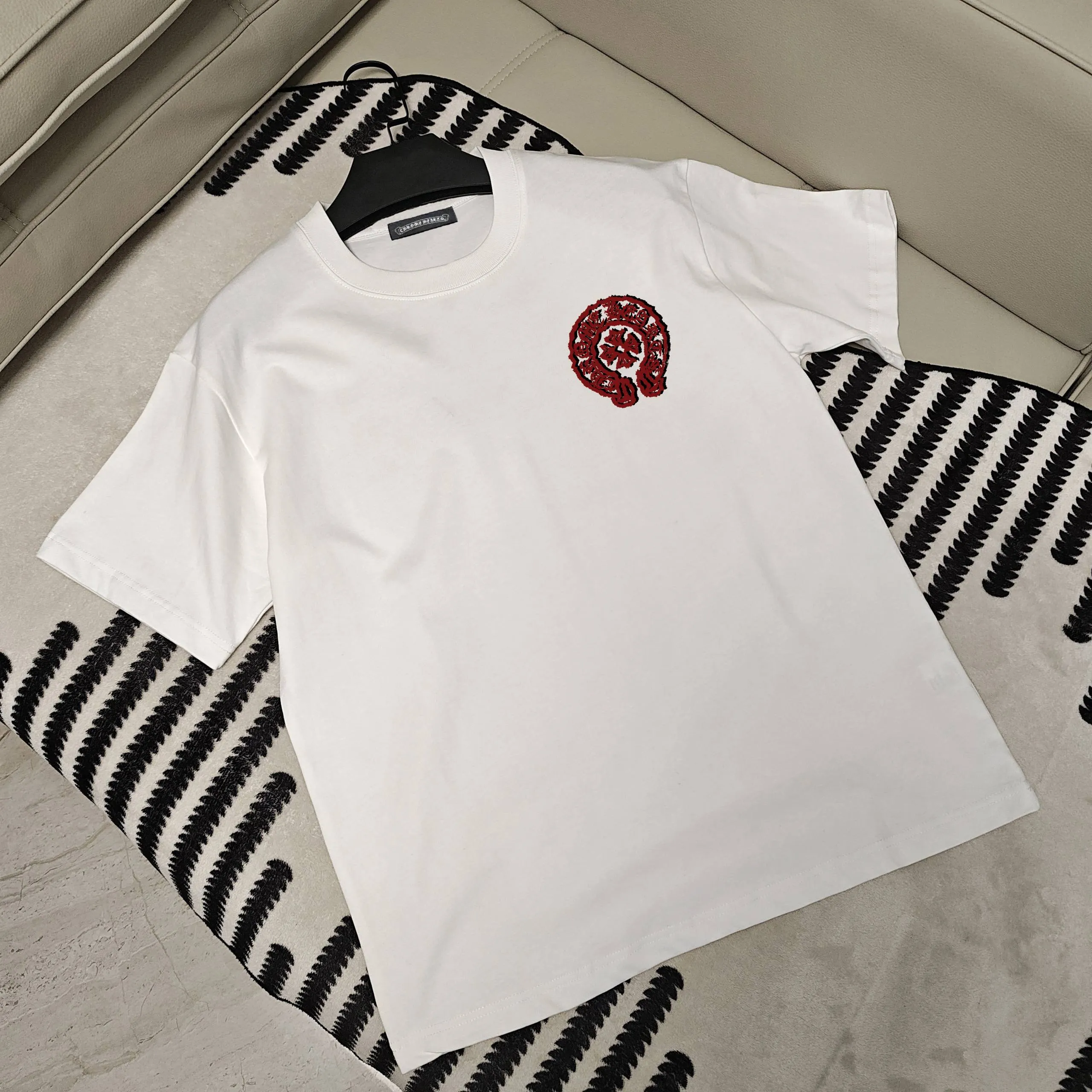 🅿️190 Crow Heart’s new summer T-shirt! This Sanskrit cross printed round neck short sleeves is simply a must-have for fashionistas. Salona cotton fabric is super comfortable, soft and skin-friendly, and has excellent breathability, making it perfect for summer wear. The Sanskrit cross print design on it is amazing, full of mystery and high-end, and the details are so exquisite that it makes people scream. It is worthy of Kroxin, and it vividly interprets the trend and personality. The loose fit is super friendly to all body shapes, covers the flesh and is comfortable, and looks good no matter how you wear it. Pair it with jeans and you'll look cool on the street. Pair it with sweatpants and you'll instantly look energetic and trendy. When you wear it and go out, you will feel like you are the spokesperson of fashion, and it will definitely turn heads. Color: black, white Size: S-2XL